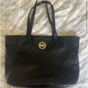 Black Michael Kors large tote bag. Gold accents.